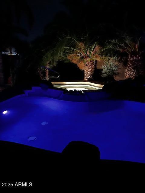 553 W Hereford Dr, San Tan Valley, AZ 85143 - pool at twilight featuring an in ground hot tub
