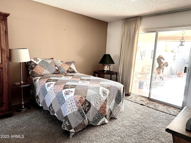 bedroom with carpet floors, access to outside, and a textured ceiling