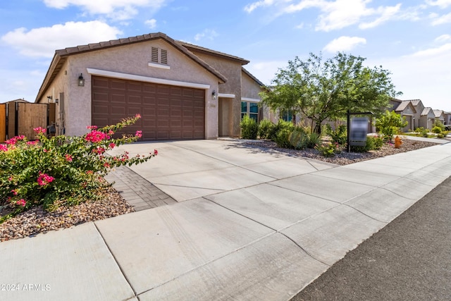 ranch-style home featuring a garage