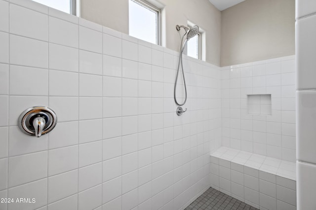 bathroom featuring a tile shower