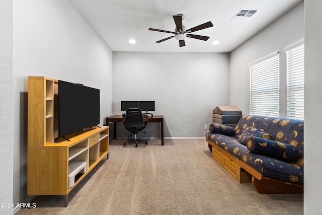 office space with ceiling fan and carpet