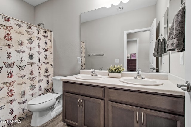 bathroom with hardwood / wood-style flooring, vanity, toilet, and a shower with shower curtain