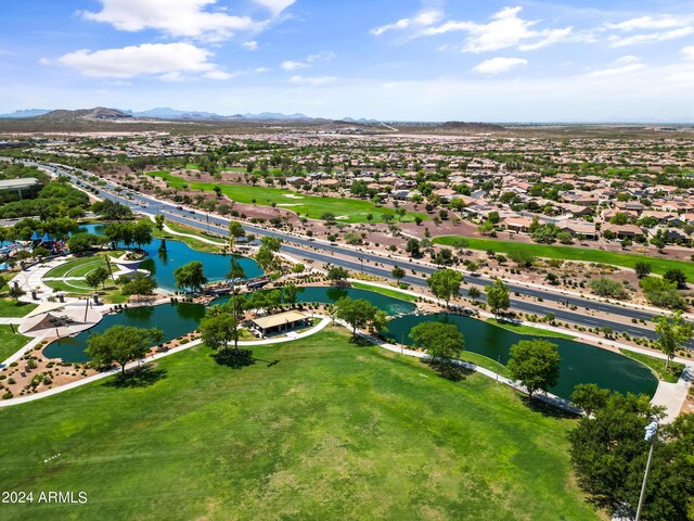 drone / aerial view with a water and mountain view