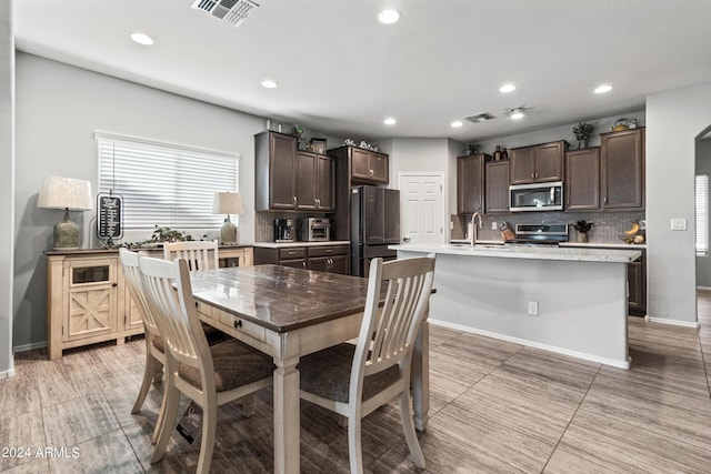 dining space featuring sink