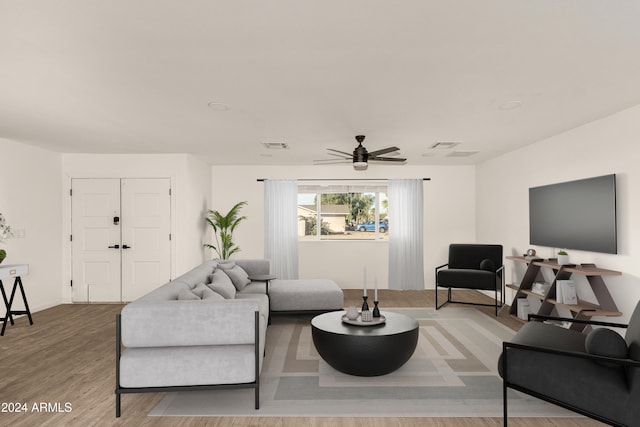 living room with ceiling fan and wood-type flooring