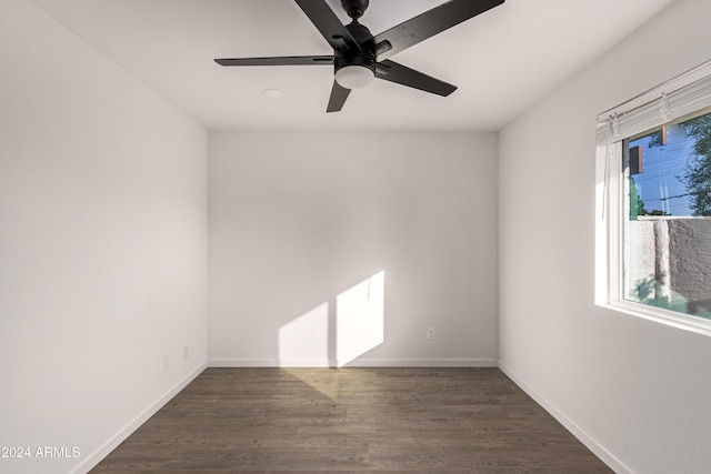 unfurnished room with ceiling fan and dark wood-type flooring