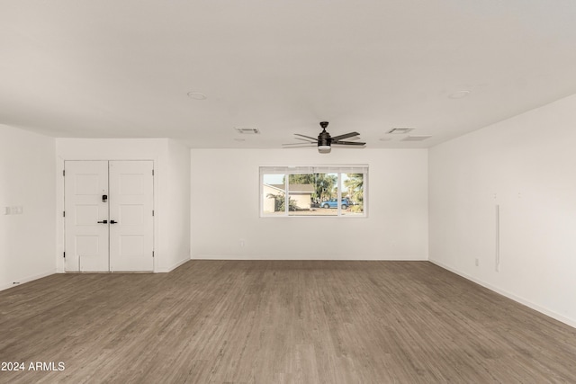 empty room featuring ceiling fan and wood-type flooring