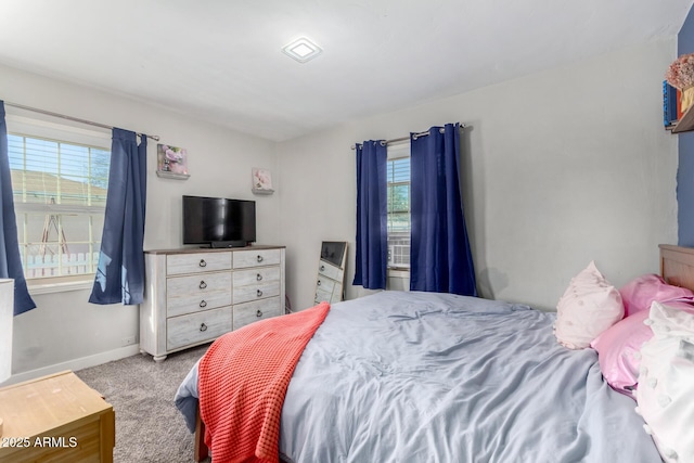 bedroom featuring light carpet