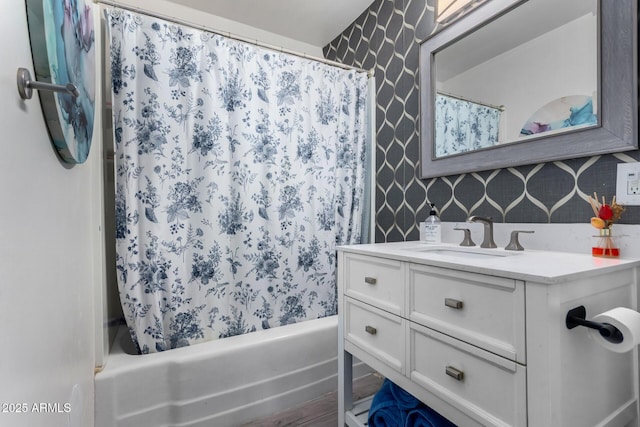 bathroom featuring vanity and shower / bath combo with shower curtain