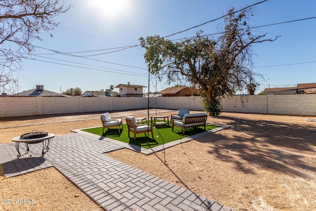 view of yard featuring a patio and a fire pit