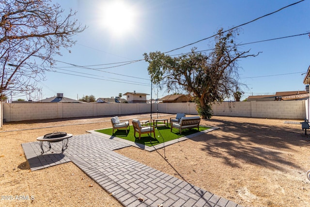 view of yard featuring a patio area and a fire pit