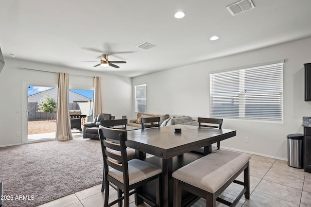 dining space with recessed lighting, visible vents, light carpet, and light tile patterned floors