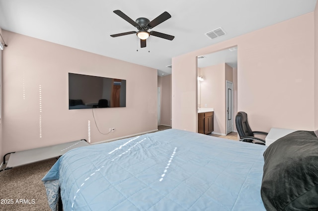 bedroom with visible vents, light colored carpet, and ceiling fan