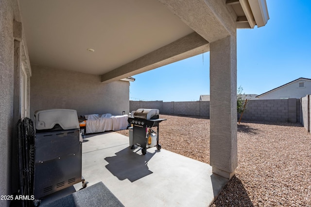 view of patio featuring area for grilling and a fenced backyard