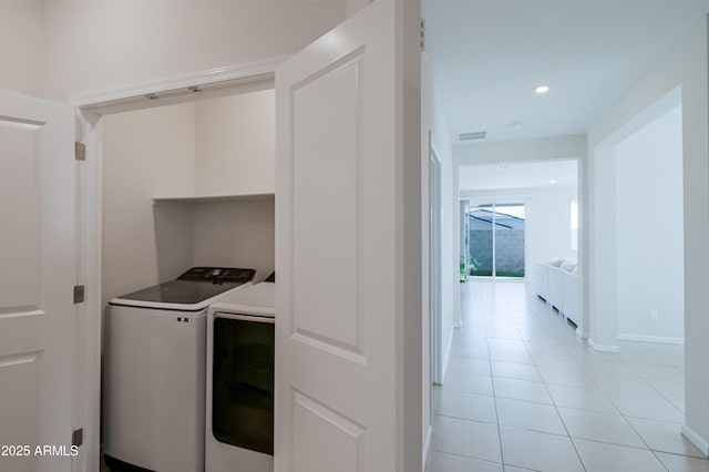 laundry room featuring laundry area, visible vents, light tile patterned flooring, washing machine and dryer, and recessed lighting