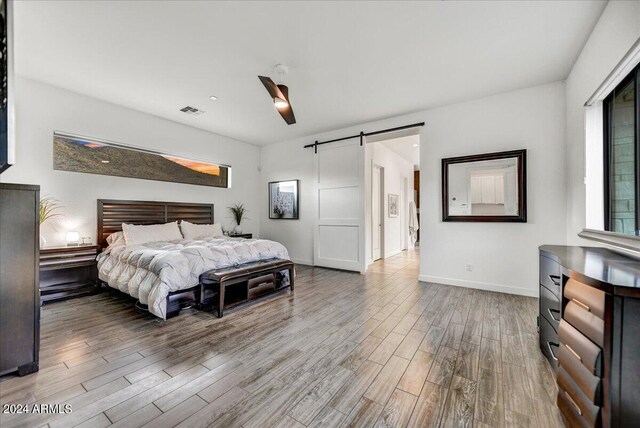 bedroom featuring light wood-type flooring and ceiling fan