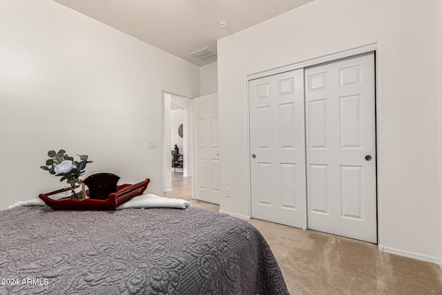 carpeted bedroom with a closet