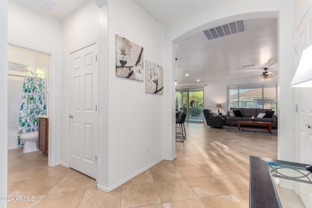 hallway with light tile patterned floors