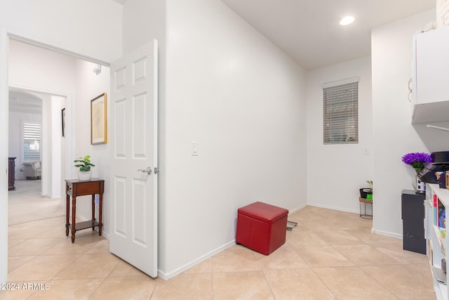 hallway with light tile patterned flooring