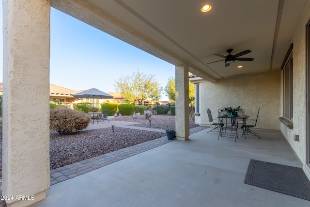 view of patio featuring ceiling fan