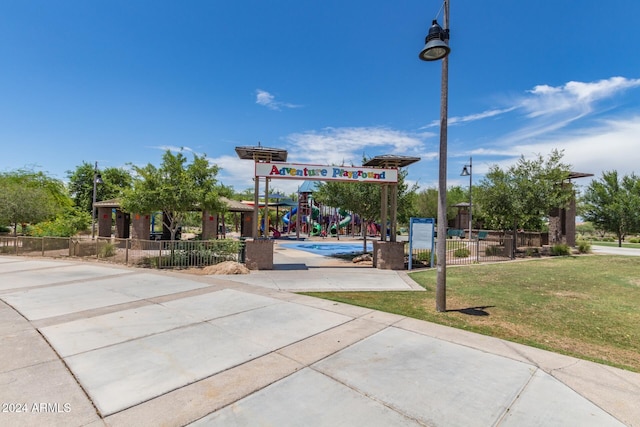 view of community with a yard and a playground