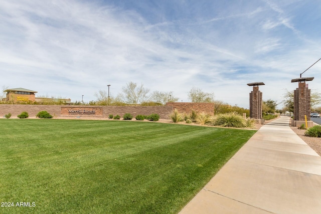 view of home's community featuring a yard