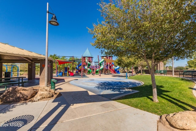 view of play area featuring a gazebo and a lawn