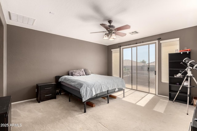 bedroom with visible vents, light carpet, a ceiling fan, and access to outside