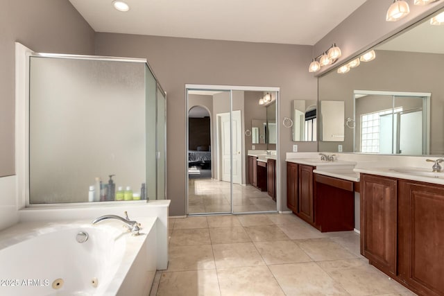 full bath with vanity, a stall shower, a whirlpool tub, tile patterned floors, and connected bathroom