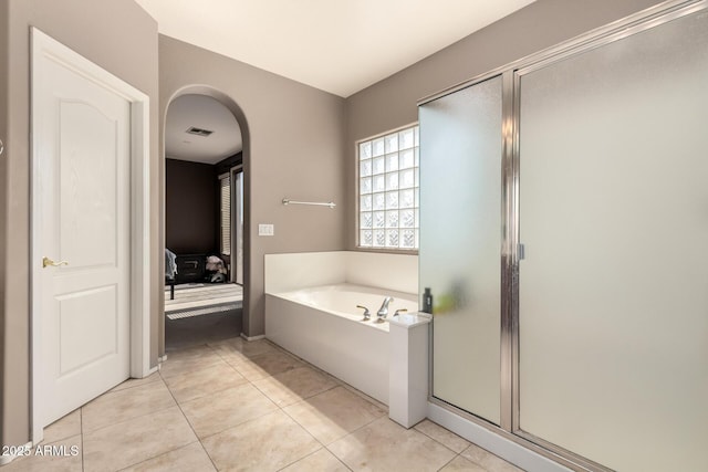 bathroom with visible vents, tile patterned flooring, a shower stall, ensuite bathroom, and a bath