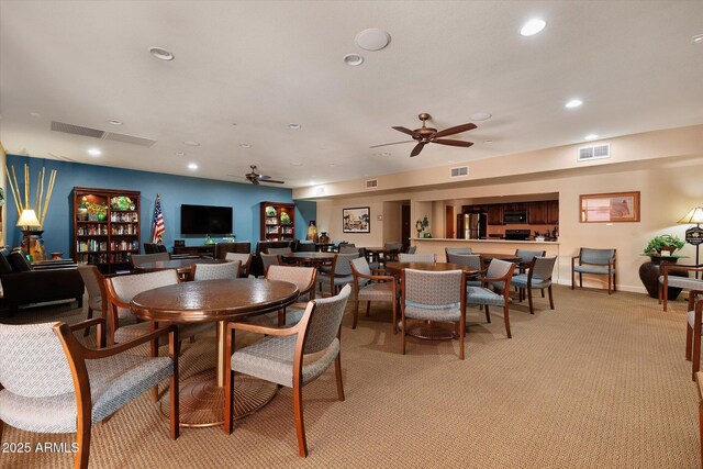 dining room featuring light carpet, ceiling fan, visible vents, and recessed lighting