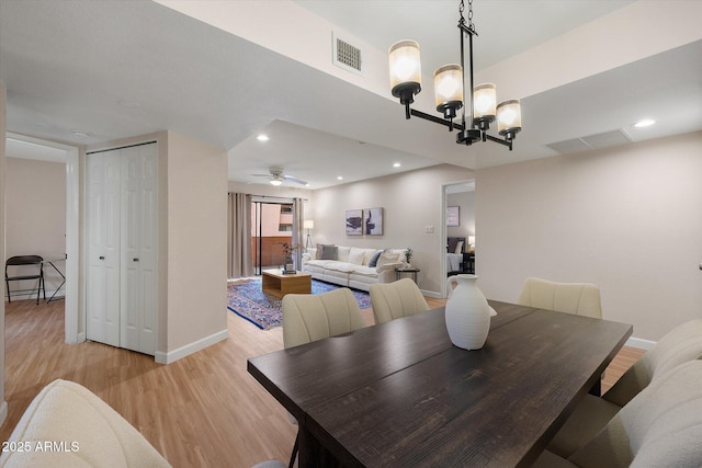 dining space featuring light wood finished floors, recessed lighting, visible vents, and baseboards