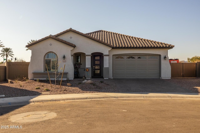 mediterranean / spanish house featuring a garage