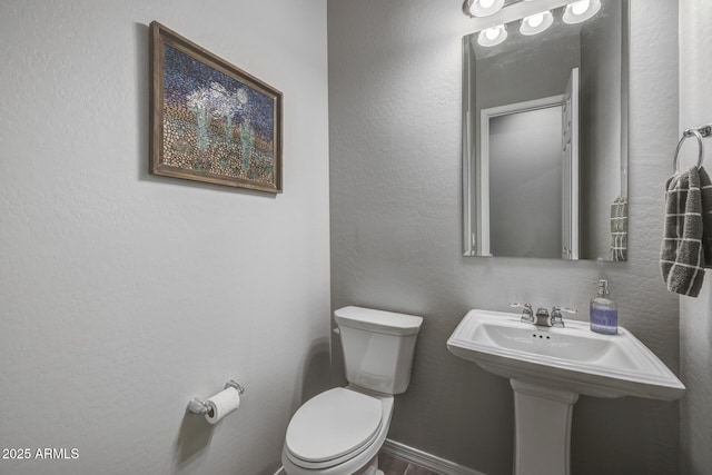 bathroom with sink and toilet