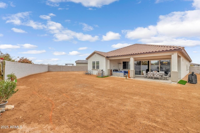 rear view of house featuring a patio area