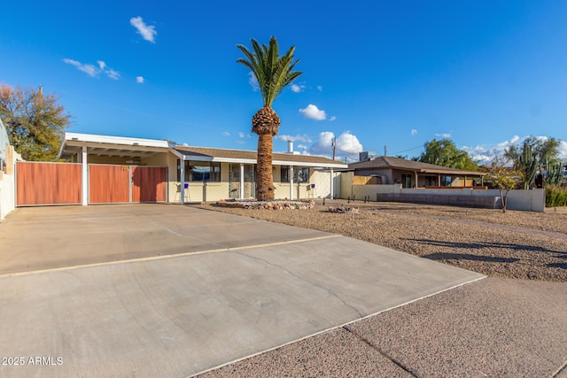 single story home featuring a carport