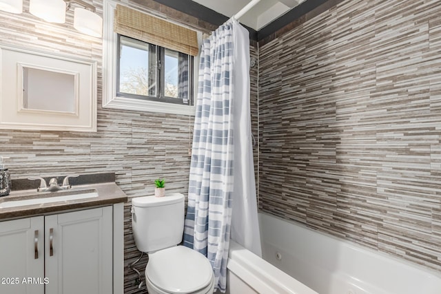 full bathroom featuring vanity, tile walls, shower / tub combo, and toilet