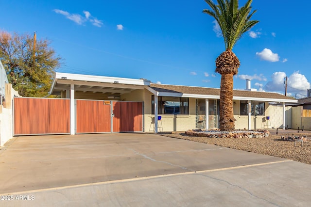 ranch-style home with a carport