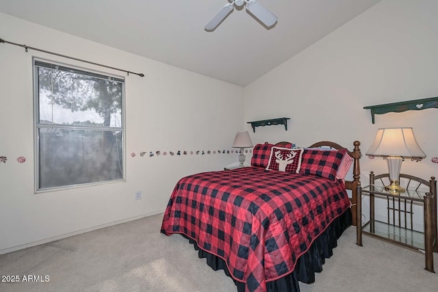 bedroom featuring ceiling fan, light colored carpet, and vaulted ceiling