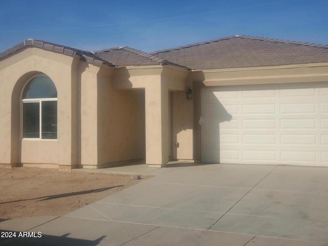 view of front of property with a garage