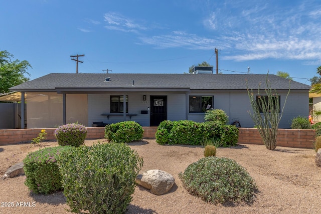 7727 E 4th St, Scottsdale, AZ 85251 - ranch-style home featuring covered porch and roof with shingles