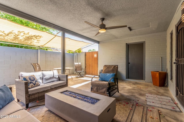 7727 E 4th St, Scottsdale, AZ 85251 - view of patio / terrace with fence, a ceiling fan, and an outdoor living space with a fire pit