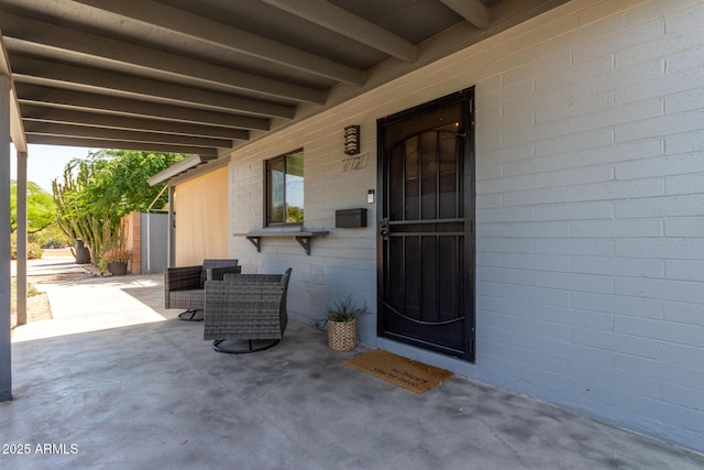 7727 E 4th St, Scottsdale, AZ 85251 - doorway to property with a patio area