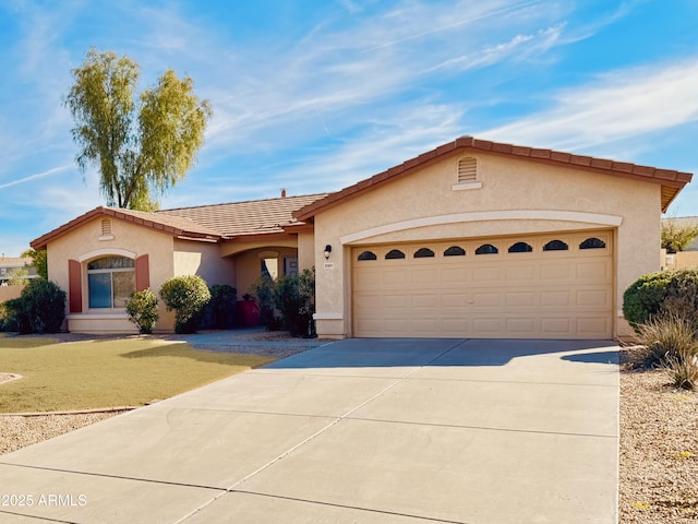 view of front of property with a garage and a front lawn