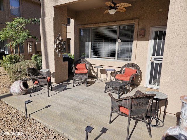 view of patio featuring ceiling fan and a wooden deck