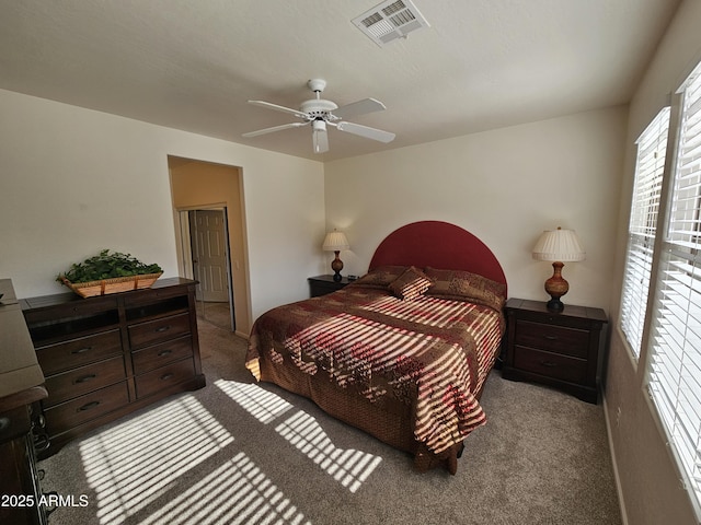 bedroom featuring carpet, visible vents, and ceiling fan