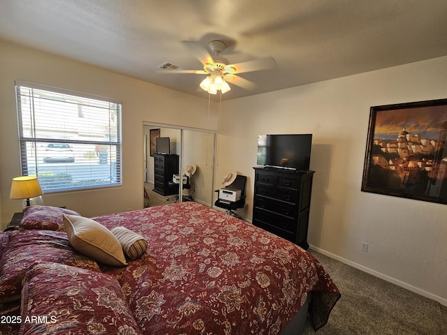 bedroom featuring a closet, visible vents, a ceiling fan, carpet flooring, and baseboards