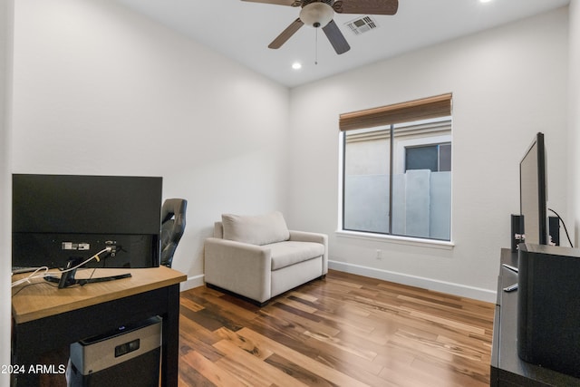 office area with ceiling fan and hardwood / wood-style floors