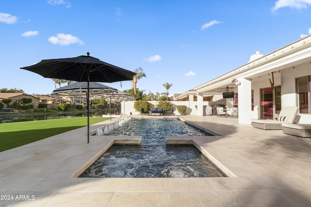 view of pool with a patio area and an in ground hot tub