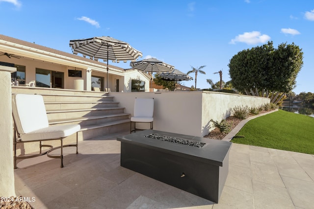 view of patio featuring a fire pit